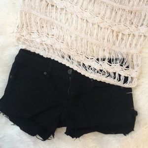 Black jean cut off shorts.